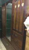 An Art Nouveau inlaid mahogany mirrored door wardrobe
