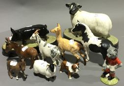 A menagerie of Beswick animals including donkeys, sheep, goat, deer, pig and bull dog, etc.
