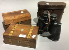 A pair of binoculars and two boxes