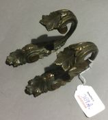 A pair of 18th century curtain tie backs