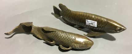 Two brass model fish