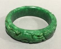 A carved jade bangle