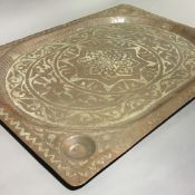 An Islamic copper tray