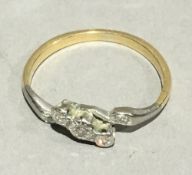 A gold and diamond crossover ring