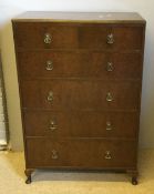 A 20th century walnut chest of drawers