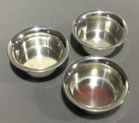 Three silver floating tea light holders