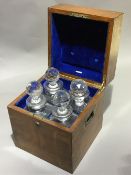 A Victorian brass bound oak four bottle decanter box