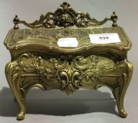 An ornate brass jewellery casket