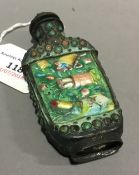 A Chinese enamel and turquoise snuff bottle