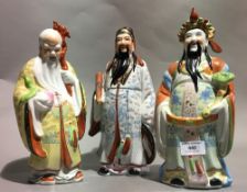 A set of three Chinese porcelain immortal figures