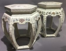 A pair of Chinese white painted urn stands
