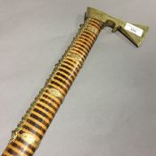 An unusual Chinese brass mounted zebra/tiger wood walking stick