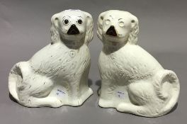 A pair of Staffordshire pottery spaniels