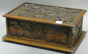 A Victorian florally carved oak box