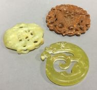 Three carved jade roundels/pendants