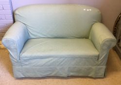 A drop end upholstered sofa