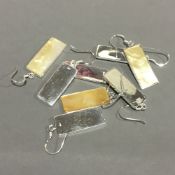 Four pairs of silver and mother-of-pearl earrings