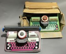Two Mettoy tin plate typewriters (one boxed)