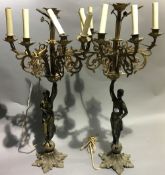 A pair of bronze figural candelabra