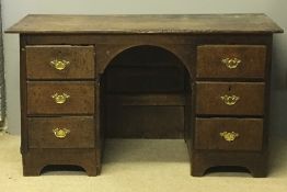 A 19th century oak knee hole desk,