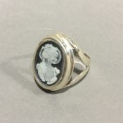 A silver cameo ring