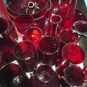 A large collection of red ground glassware