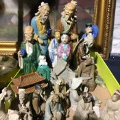 A quantity of small Oriental porcelain figures