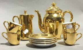 A Royal Worcester gold lustre coffee set