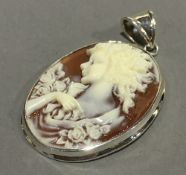 A silver framed cameo pendant