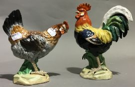 A pair of Continental porcelain cock and hen