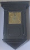 A 19th century ebonised wall clock The case of architectural form with stepped cornice above a band
