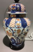 An antique porcelain vase and cover in the Imari palette,