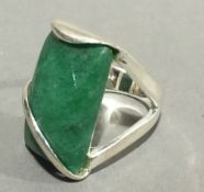 A silver and jade ring
