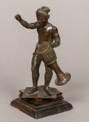 An Indian cast bronze figure of a drummer Standing on a wooden plinth base. 18.5 cm high.