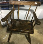 A 19th century Welsh elm comb/stick back armchair