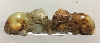 A Chinese carved jade double temple lion group