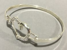 A silver heart bangle