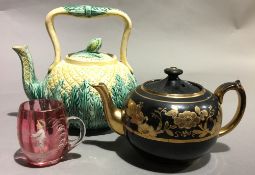 Two Victorian teapots and a Mary Gregory type cranberry glass beaker