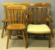 Four pine chairs and a caned open armchair