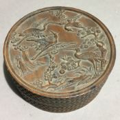 A Chinese wooden round box