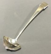 A small silver ladle