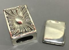 A silver matchbox sleeve and a silver match case