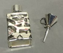 A Sterling silver on laid perfume bottle and funnel
