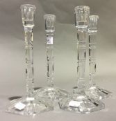 A set of four cut glass candlesticks