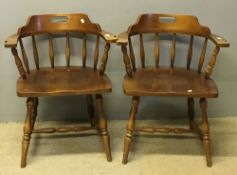 A pair of smokers bow armchairs