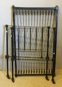 A Victorian black painted single bed