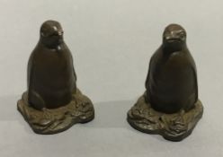 A pair of Chinese bronze penguins