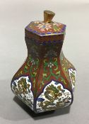 A Chinese cloisonne vase and cover decorated with dragons