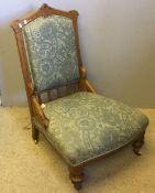 A Victorian Arts & Crafts oak nursing chair