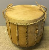 An animal hide covered drum